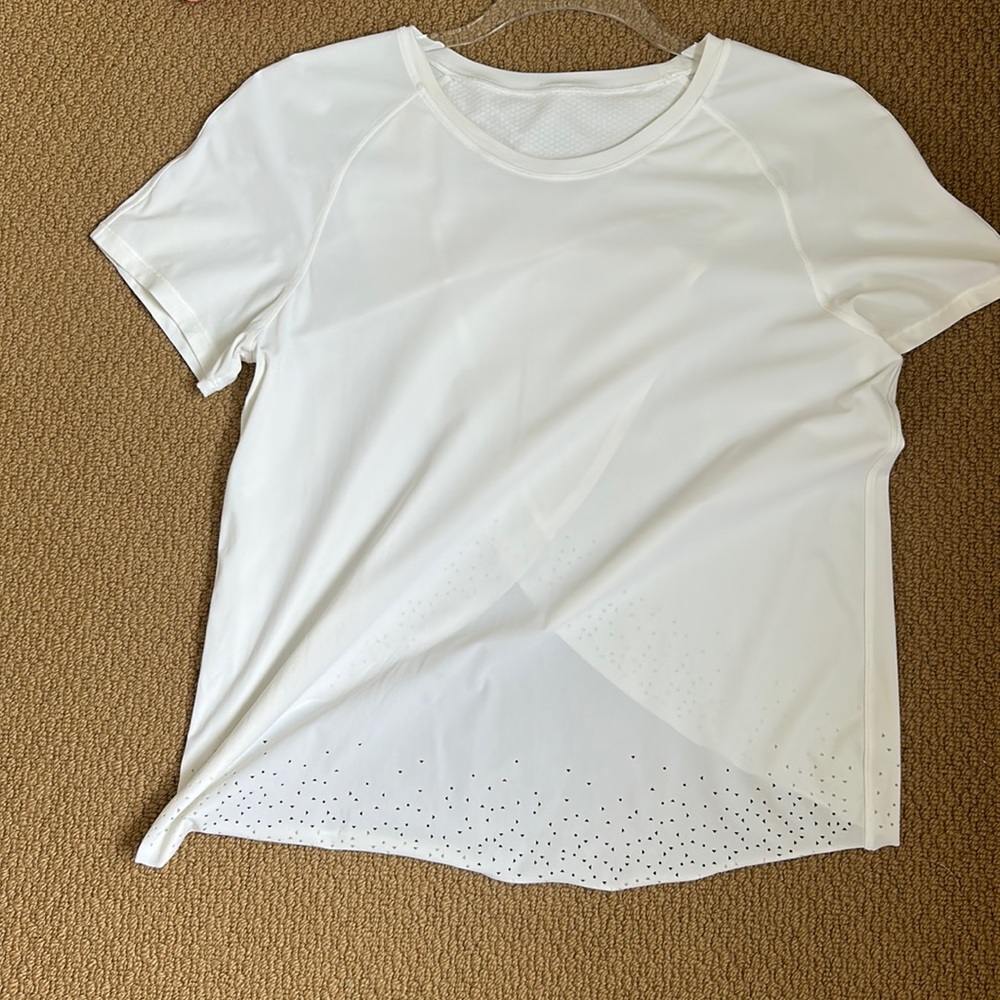 white lululemon shirt with little triangle cutouts on it (don’t know exact name)